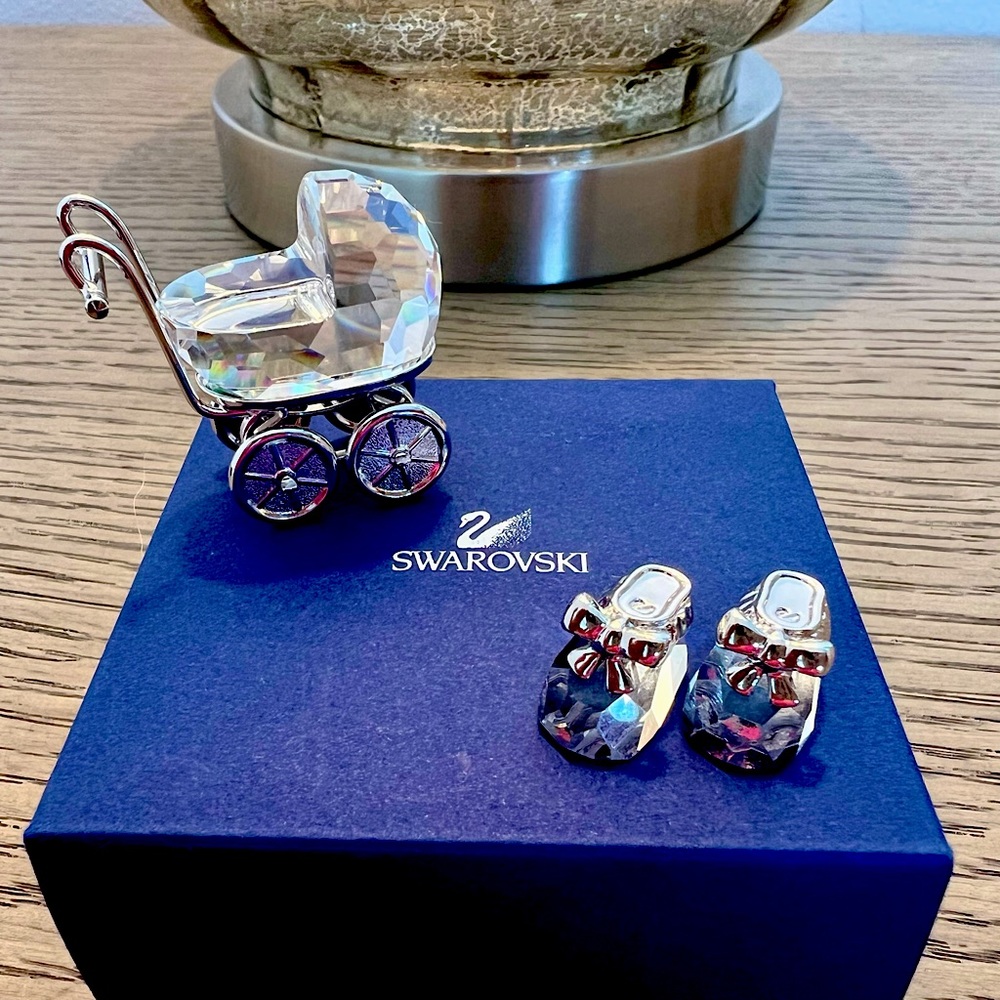 Swarovski baby carriage, baby shoes and mirror to set pieces on. Sold as a set.